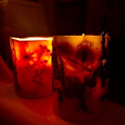 Botanical Candera candles glowing softly in the dark