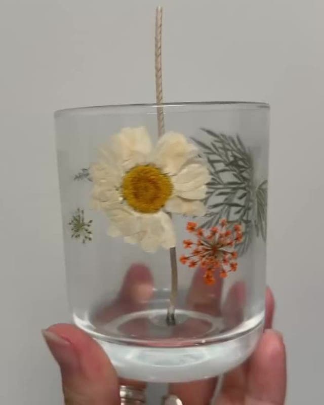 Arranging pressed flowers before the pour